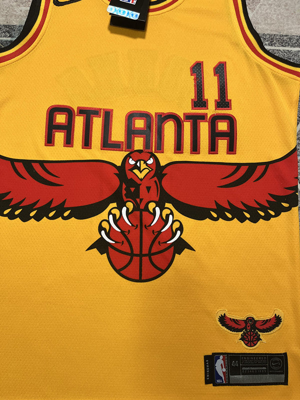 Yellow Atlanta Hawks basketball jersey, front graphic detail