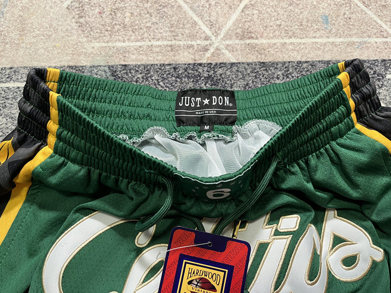 Green Boston Celtics premium basketball shorts, waistband and label detail