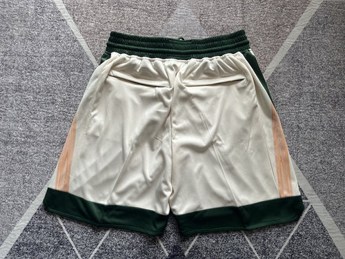 Beige Boston Celtics premium basketball shorts, full back view