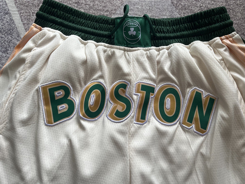 Beige Boston Celtics premium basketball shorts, waistband and label detail
