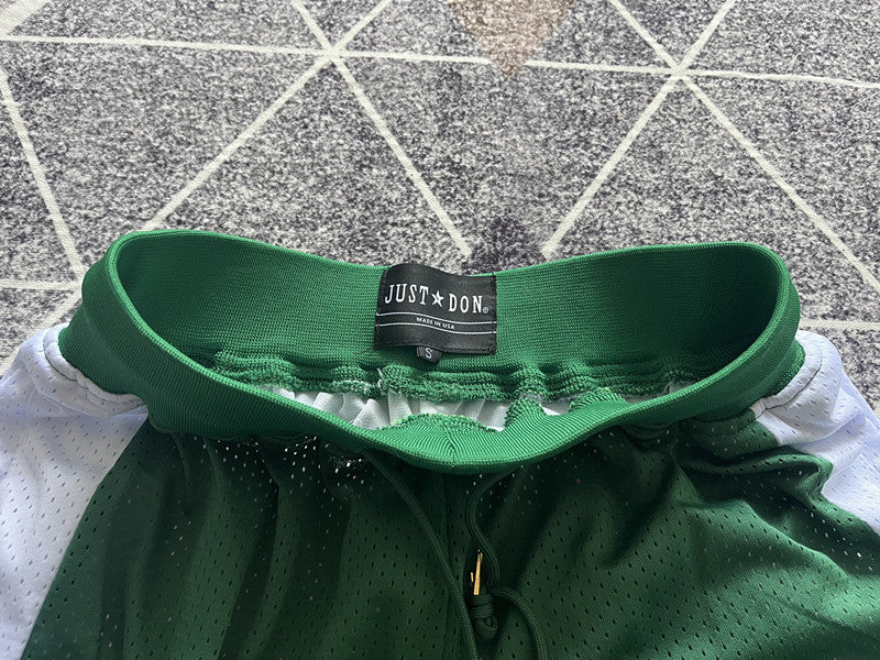 Green Boston Celtics premium basketball shorts, waistband and label detail