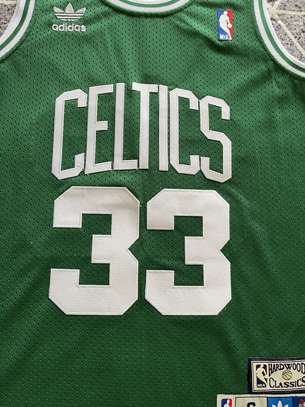 Green Boston Celtics basketball jersey, front graphic detail