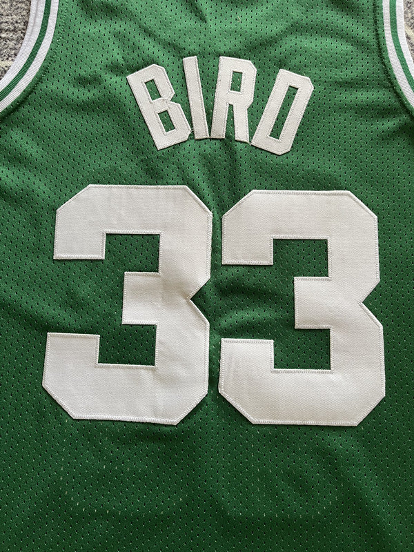 Green Boston Celtics basketball jersey, back lettering and number detail