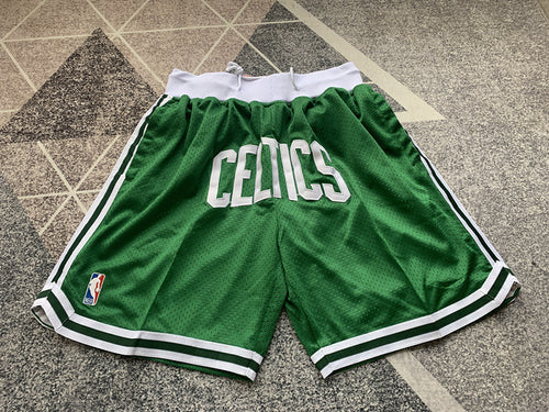 Green Boston Celtics premium basketball shorts, full front view