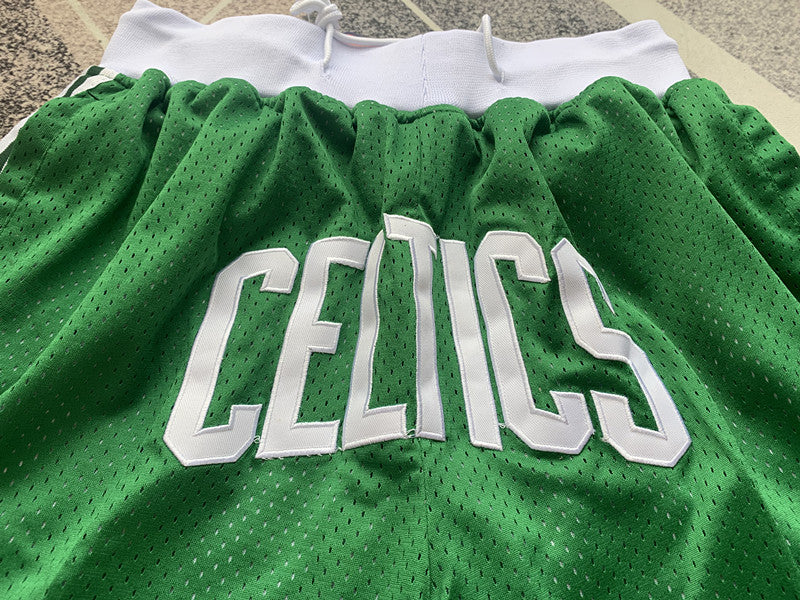 Green Boston Celtics premium basketball shorts, graphic detail