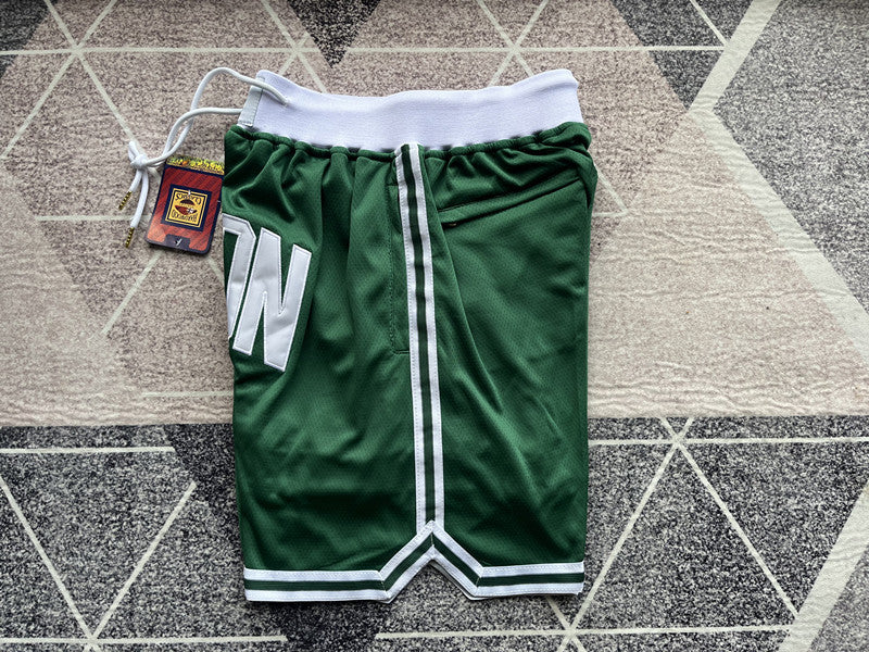 Green Boston Celtics premium basketball shorts, side panel detail
