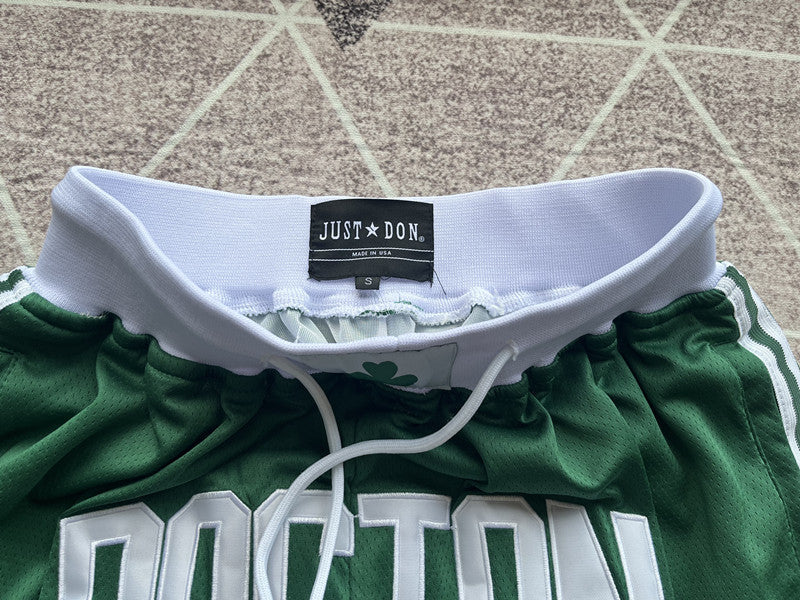Green Boston Celtics premium basketball shorts, waistband and label detail