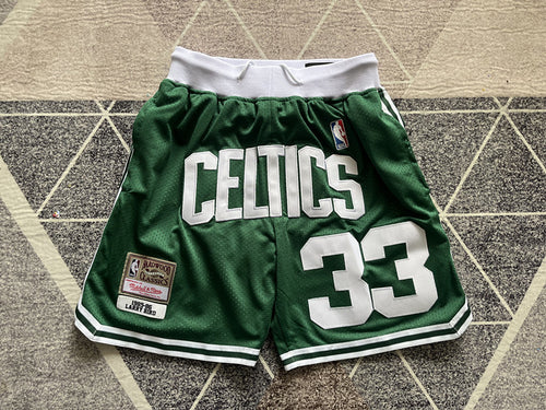 Green Boston Celtics premium basketball shorts, full front view