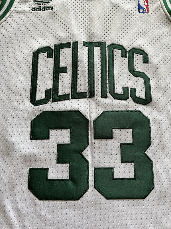 White Boston Celtics basketball jersey, front graphic detail