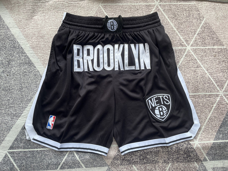 Black Brooklyn Nets premium basketball shorts, full front view