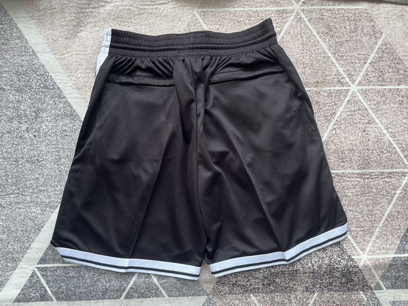 Black Brooklyn Nets premium basketball shorts, full back view