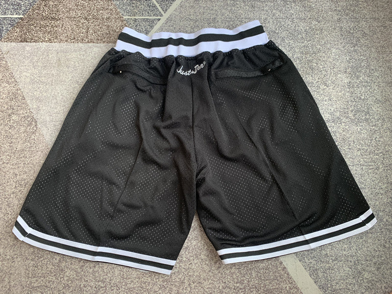 Black Brooklyn Nets premium basketball shorts, full back view