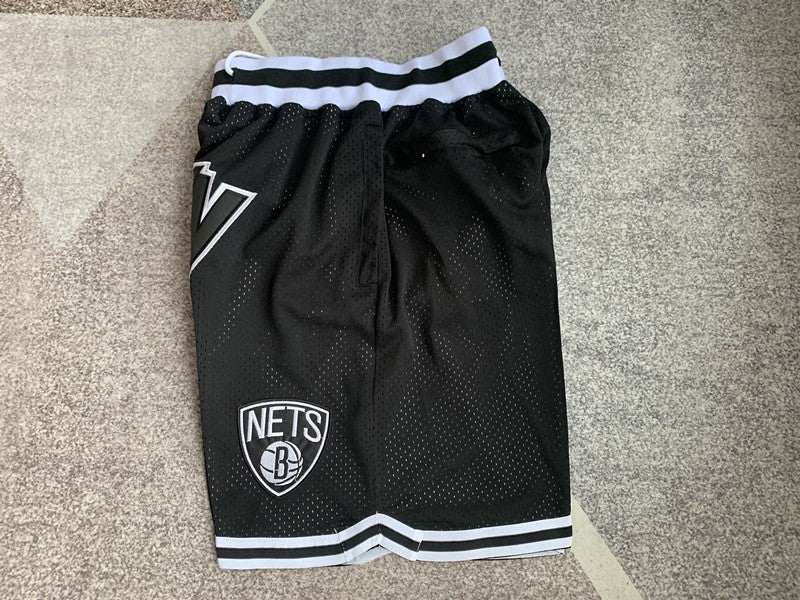 Black Brooklyn Nets premium basketball shorts, side panel detail