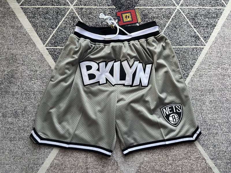 Gray Brooklyn Nets premium basketball shorts, full front view