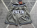 Gray Brooklyn Nets premium basketball shorts, full front view