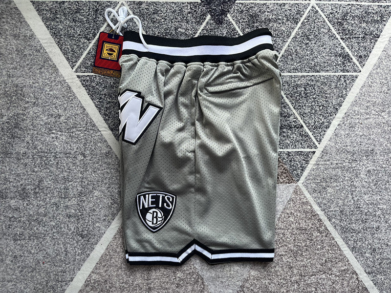 Gray Brooklyn Nets premium basketball shorts, side panel detail