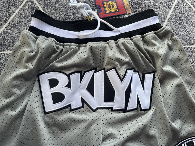 Gray Brooklyn Nets premium basketball shorts, graphic detail