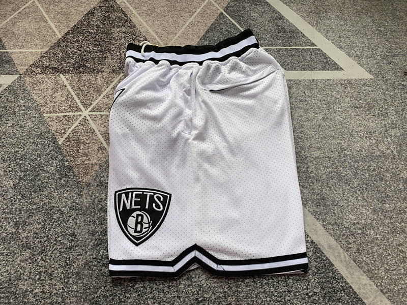 White Brooklyn Nets premium basketball shorts, side panel detail