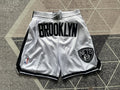 White Brooklyn Nets premium basketball shorts, full front view