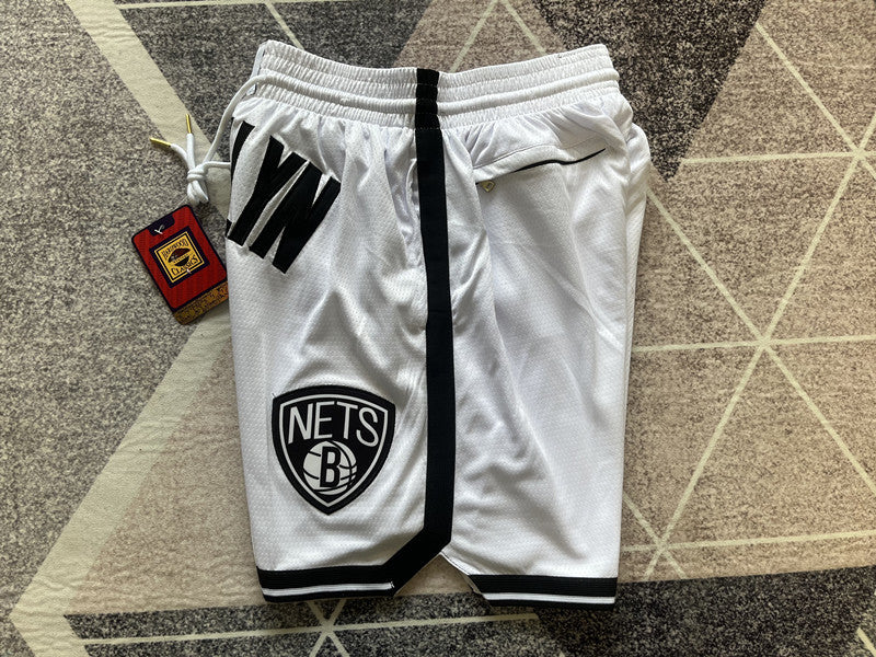White Brooklyn Nets premium basketball shorts, side panel detail