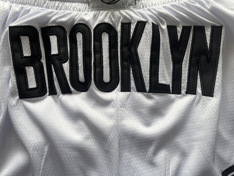 White Brooklyn Nets premium basketball shorts, waistband and label detail