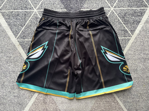 Black Charlotte Hornets premium basketball shorts, full back view