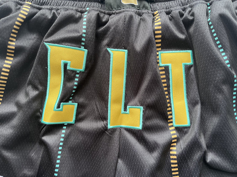 Black Charlotte Hornets premium basketball shorts, waistband and label detail