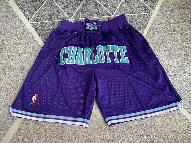 Multi-color Charlotte Hornets premium basketball shorts, full front view