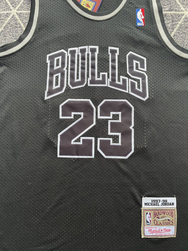Black Chicago Bulls basketball jersey, front graphic detail