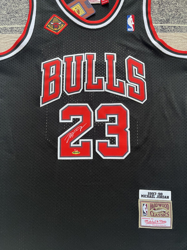 Black Chicago Bulls basketball jersey, front graphic detail