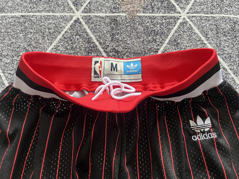 Black and Red and White Chicago Bulls basketball shorts, waistband and logo detail