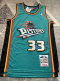 Green Detroit Pistons basketball jersey, full front view