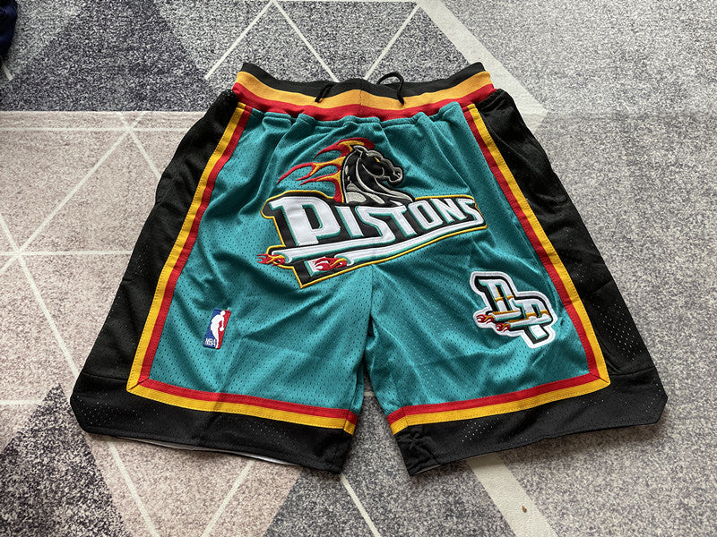 Green Detroit Pistons premium basketball shorts, full front view