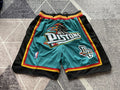 Green Detroit Pistons premium basketball shorts, full front view