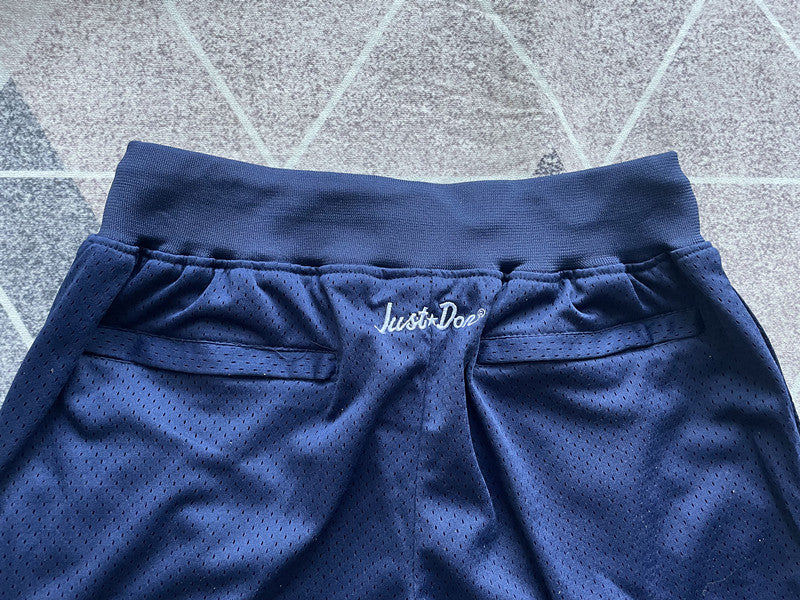 Navy Empire premium basketball shorts, waistband and label detail