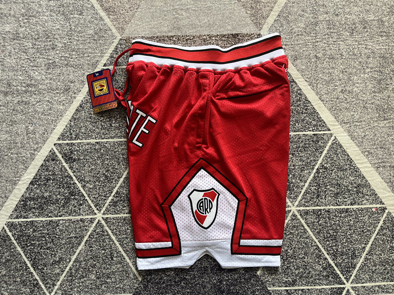 Red Generic Style premium basketball shorts, side panel detail