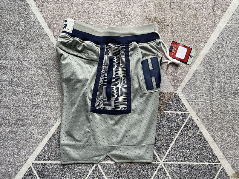 Gray Georgetown premium basketball shorts, side panel detail