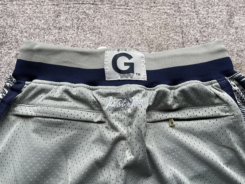 Gray Georgetown premium basketball shorts, waistband and label detail