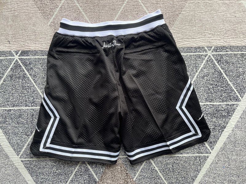 Black Jumpman premium basketball shorts, full back view