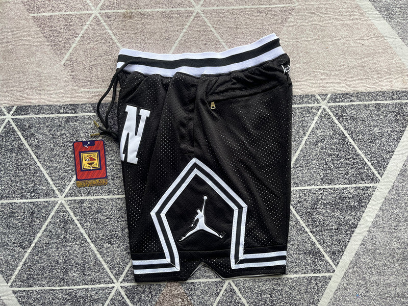 Black Jumpman premium basketball shorts, side panel detail