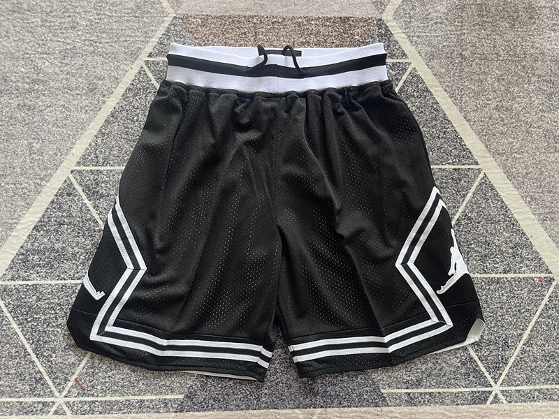 Black Jumpman basketball shorts, full front view
