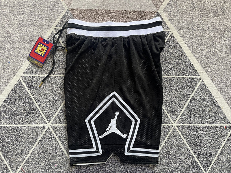 Black Jumpman basketball shorts, side panel detail