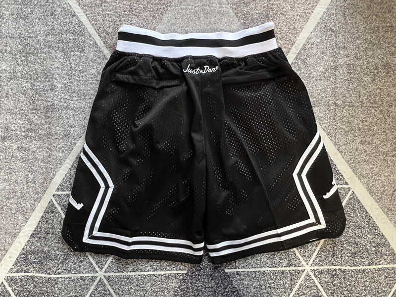 Black Jumpman premium basketball shorts, full back view