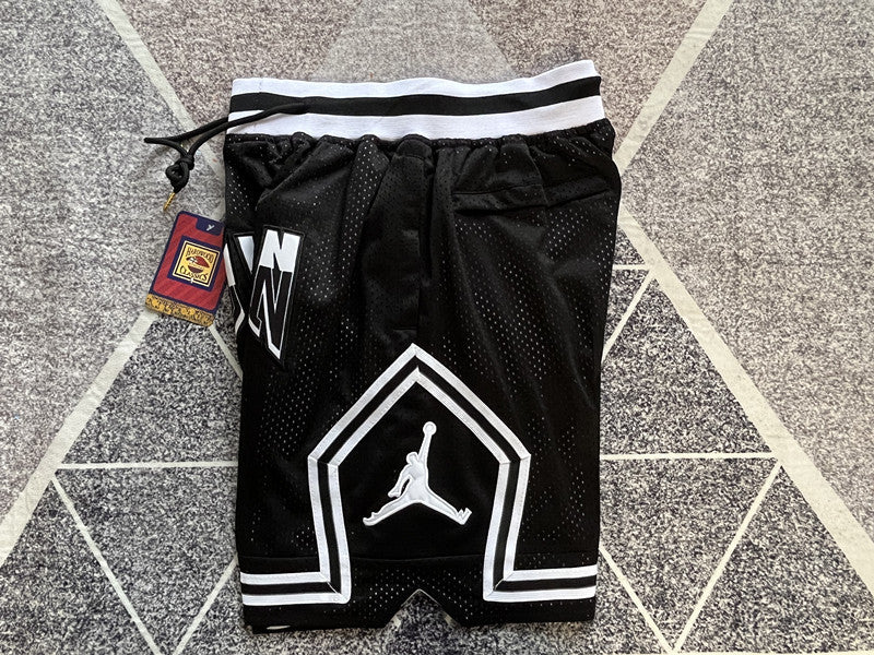 Black Jumpman premium basketball shorts, side panel detail