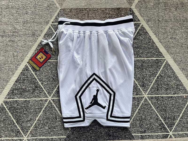 White Jumpman basketball shorts, side panel detail