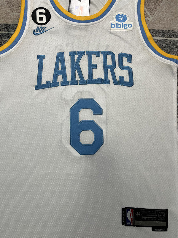 White and Blue Lettering LA Lakers basketball jersey, front graphic detail