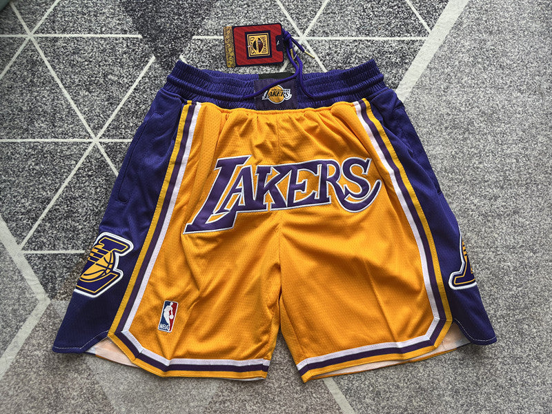 Yellow LA Lakers premium basketball shorts, full front view