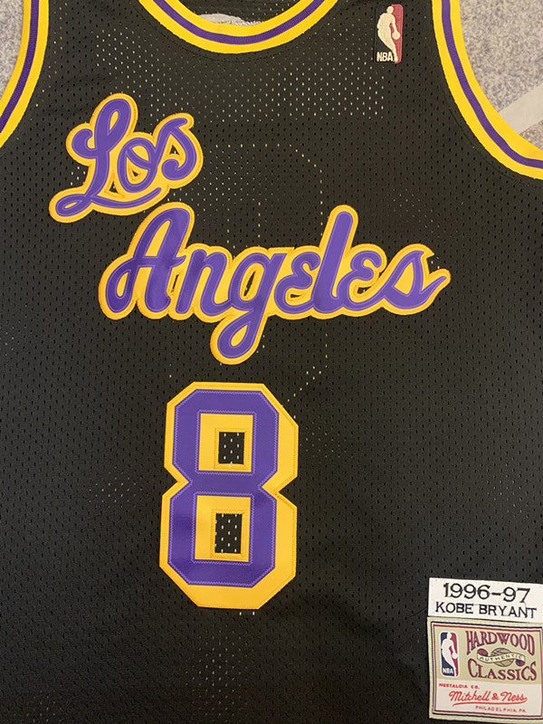 Black LA Lakers basketball jersey, front graphic detail