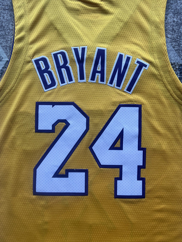 Yellow LA Lakers basketball jersey, back lettering and number detail