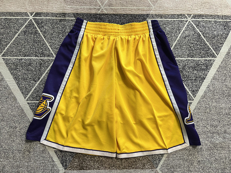 Yellow LA Lakers basketball shorts, full back view